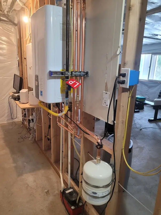 Licensed plumber repairing a kitchen sink in Eielson AFB